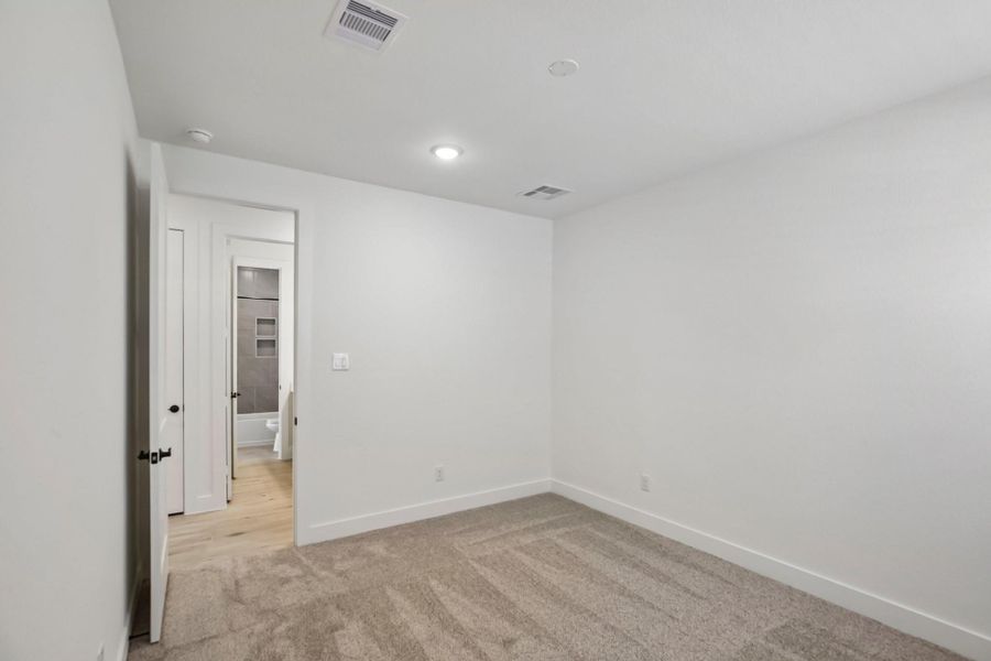 Spacious, unfurnished interior of a new home in Riceland 60',65',70', Old River-Winfree (Image 36).