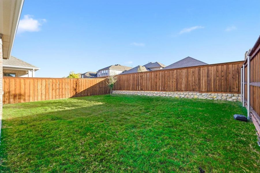 Exterior details and patio area of a home in Spiritas Ranch, Little Elm (Image 20). Exterior details and patio area of a home in Spiritas Ranch, Little Elm (Image 20).