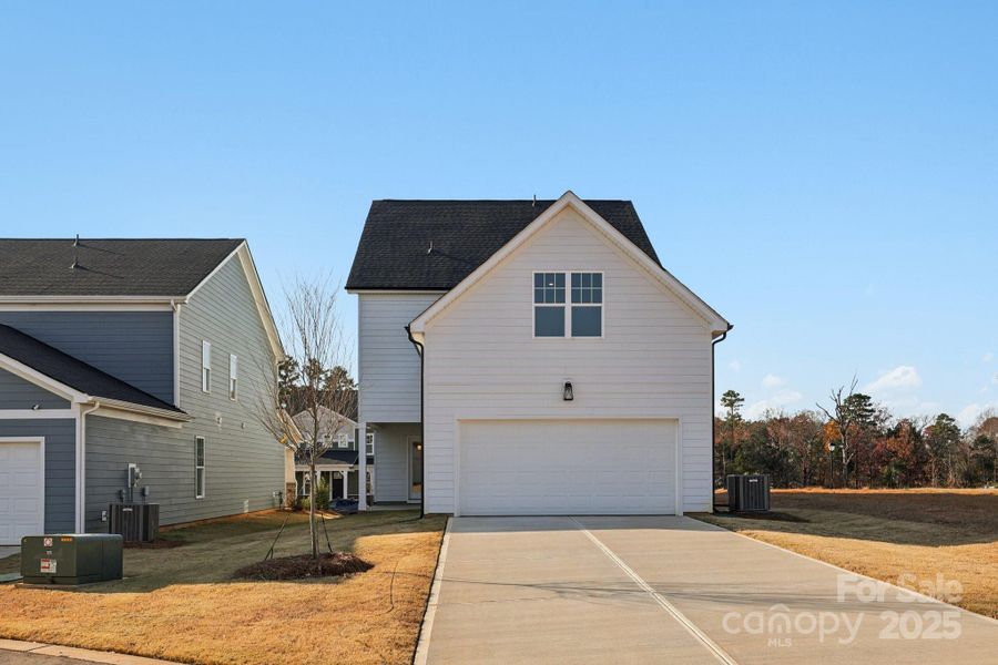 Front exterior of a new home in Edgewood Preserve, Huntersville, NC, highlighting curb appeal (Image 20).
