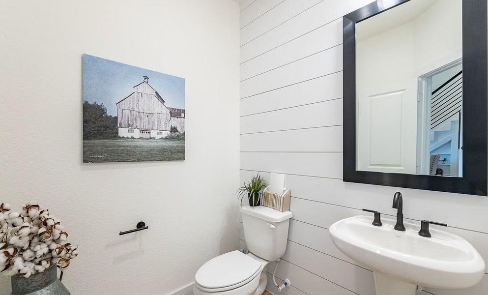 Conveniently located on the first floor, this clean and modern half bath is perfect for guests and everyday use, offering a simple, polished design that adds comfort and functionality to daily living. **Photos are representative only and may vary as built.**