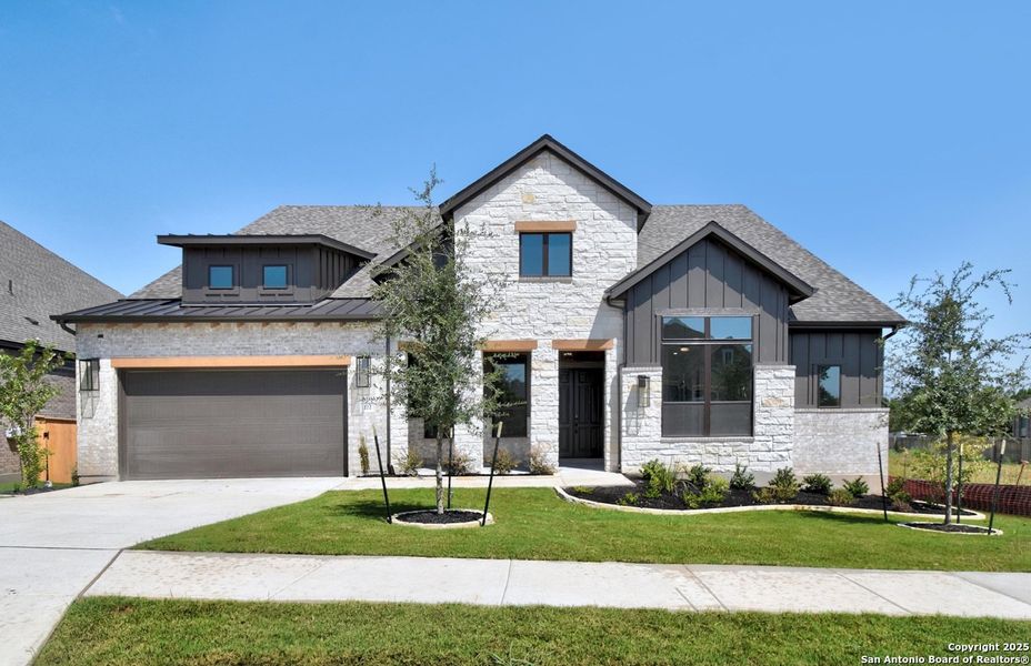 Front exterior of a new home in La Cima: 70ft. lots, San Marcos, TX, highlighting curb appeal (Image 1). Front exterior of a new home in La Cima: 70ft. lots, San Marcos, TX, highlighting curb appeal (Image 1).