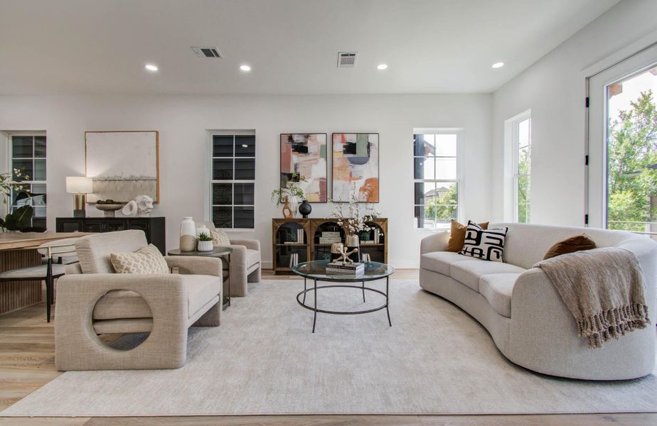 Living area is light and bright with large double-pane windows that open, and two balconies at either end.