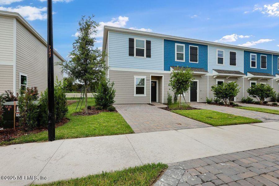 Front exterior of a new home in Sabal Terrace, Jacksonville, FL, highlighting curb appeal (Image 22).