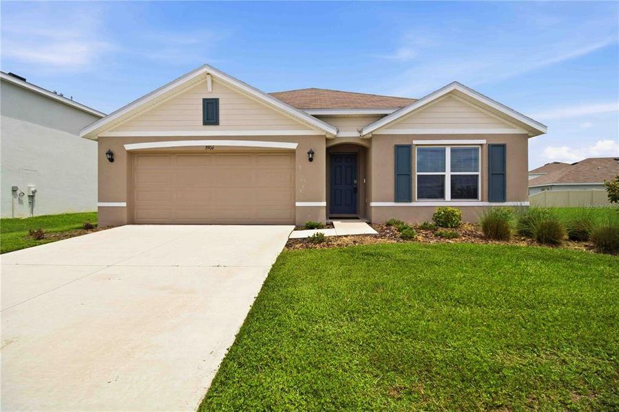 Front exterior of a new home in Mandarin Grove, Palmetto, FL, highlighting curb appeal (Image 2).