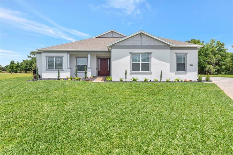 Front exterior of a new home in , Orlando, FL, highlighting curb appeal (Image 27).