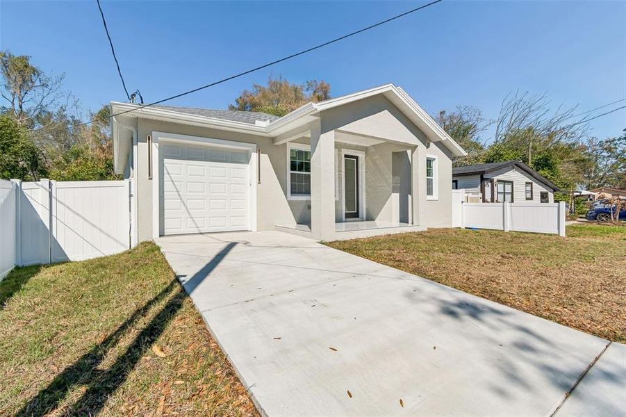 Front exterior of a new home in , Tampa, FL, highlighting curb appeal (Image 21).