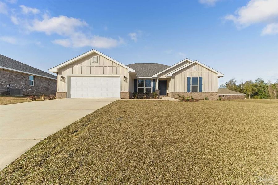 Front exterior of a new home in Pecan Valley, Cantonment, FL, highlighting curb appeal (Image 1). Front exterior of a new home in Pecan Valley, Cantonment, FL, highlighting curb appeal (Image 1).