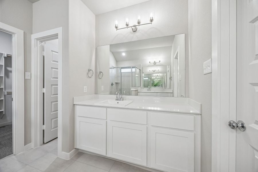 Primary Bathroom in the Heisman home plan by Trophy Signature Homes – REPRESENTATIVE PHOTO