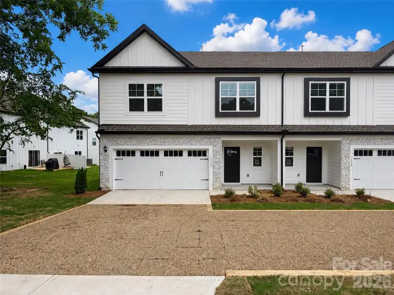 Front exterior of a new home in , Charlotte, NC, highlighting curb appeal (Image 1). Front exterior of a new home in , Charlotte, NC, highlighting curb appeal (Image 1).