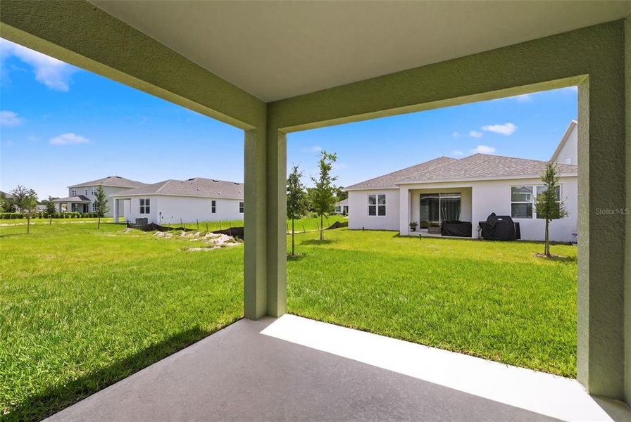 Exterior details and patio area of a home in Trinity Place, St. Cloud (Image 24).
