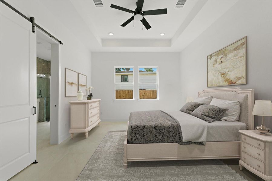 Primary bedroom complete with a ceiling fan, 11 foot trayed ceilings, recessed lighting and of course a private en-suite bath.