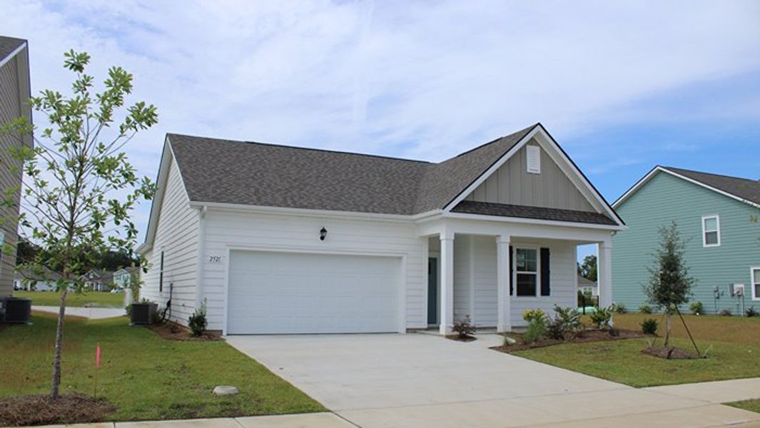 Front exterior of a new home in Auberon Woods, Conway, SC, highlighting curb appeal (Image 18). Front exterior of a new home in Auberon Woods, Conway, SC, highlighting curb appeal (Image 18).