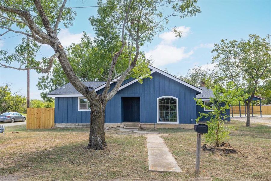 View of front of home featuring a shingled roof and board and batten siding View of front of home featuring a shingled roof and board and batten siding