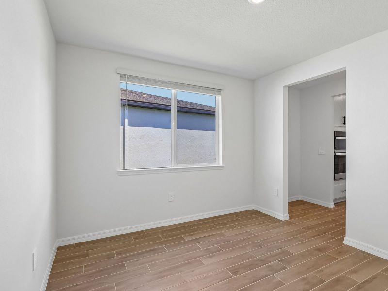 Spacious, unfurnished interior of a new home in The Grove at Stuart Crossing - Signature Series, Bartow (Image 8).