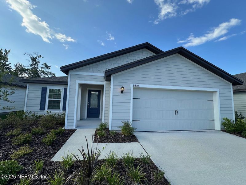 Front exterior of a new home in , Hilliard, FL, highlighting curb appeal (Image 9).
