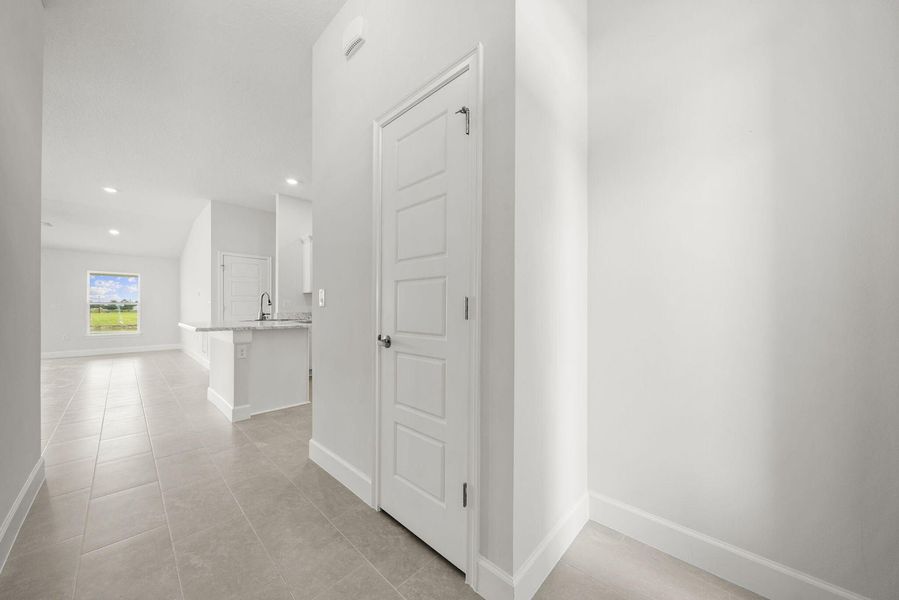 Representative unfurnished interior of a home built from the 1635 by Adams Homes in Winding Oaks, Weeki Wachee (Image 15).