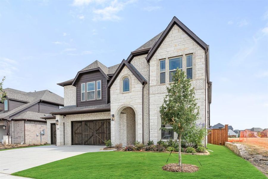 Front exterior of a new home in Mosaic, Celina, TX, highlighting curb appeal (Image 2). Front exterior of a new home in Mosaic, Celina, TX, highlighting curb appeal (Image 2).