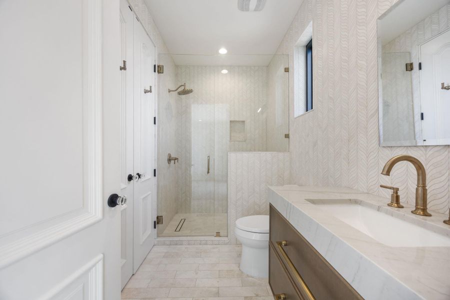 A well-appointed bathroom with a spacious walk-in shower and elegant vanity. A well-appointed bathroom with a spacious walk-in shower and elegant vanity.