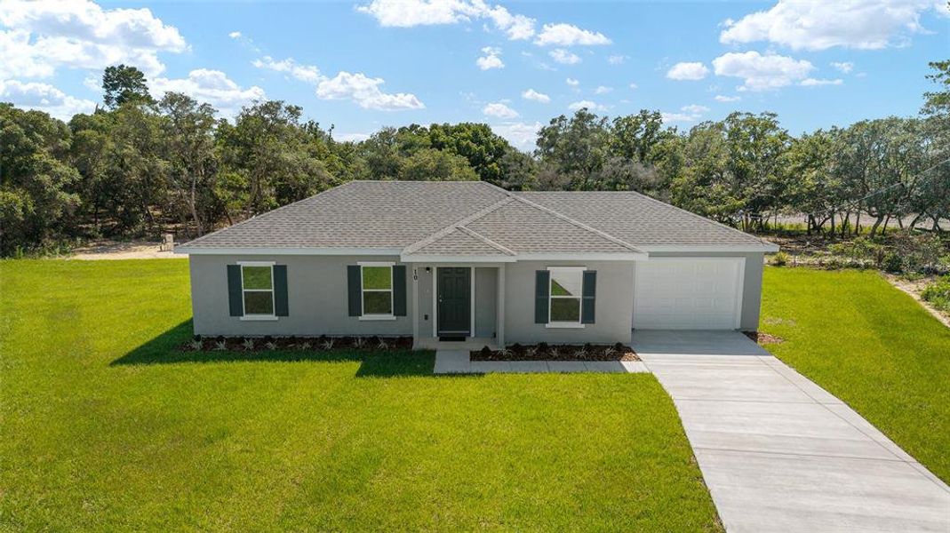 Front exterior of a new home in , Ocala, FL, highlighting curb appeal (Image 17).