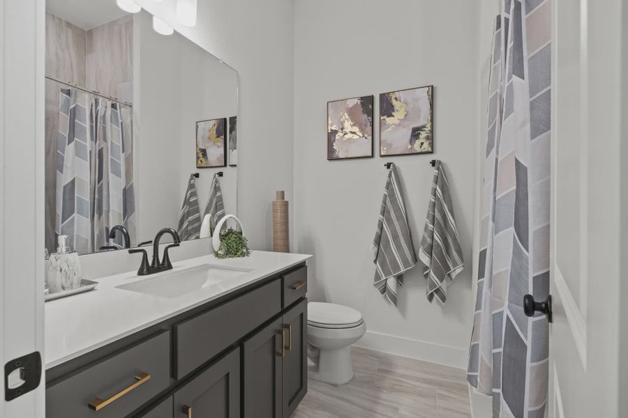 Representative furnished interior of a home built from the Silas by Chesmar Homes in 6 Creeks, Kyle (Image 18).