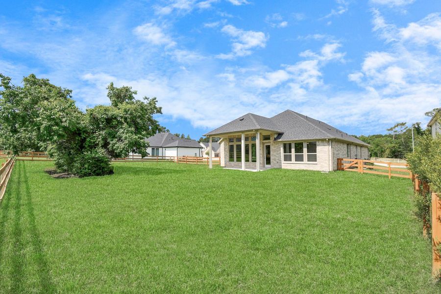 Front exterior of a new home in Timber Hollow: Heritage Collection, Magnolia, TX, highlighting curb appeal (Image 20). Front exterior of a new home in Timber Hollow: Heritage Collection, Magnolia, TX, highlighting curb appeal (Image 20).