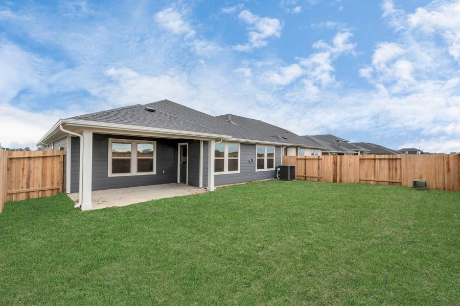Exterior details and patio area of a home in Montgomery Ridge: Landmark Collection, Montgomery (Image 2).
