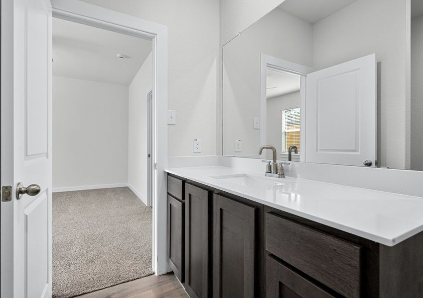 The master bathroom has a sprawling vanity.
