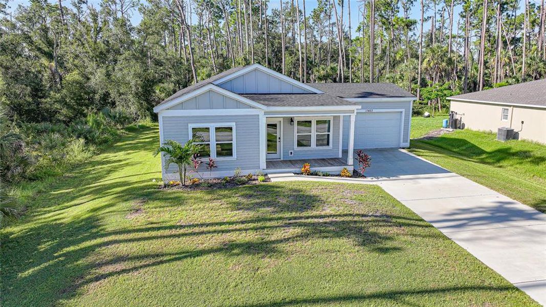 Front exterior of a new home in , Port Charlotte, FL, highlighting curb appeal (Image 2).