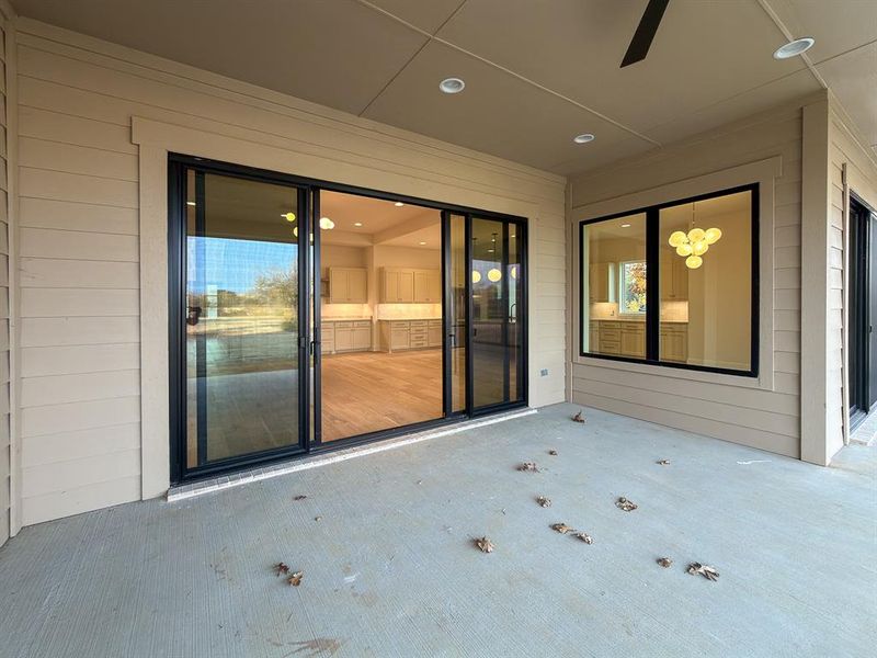 Spacious covered patio with concrete flooring