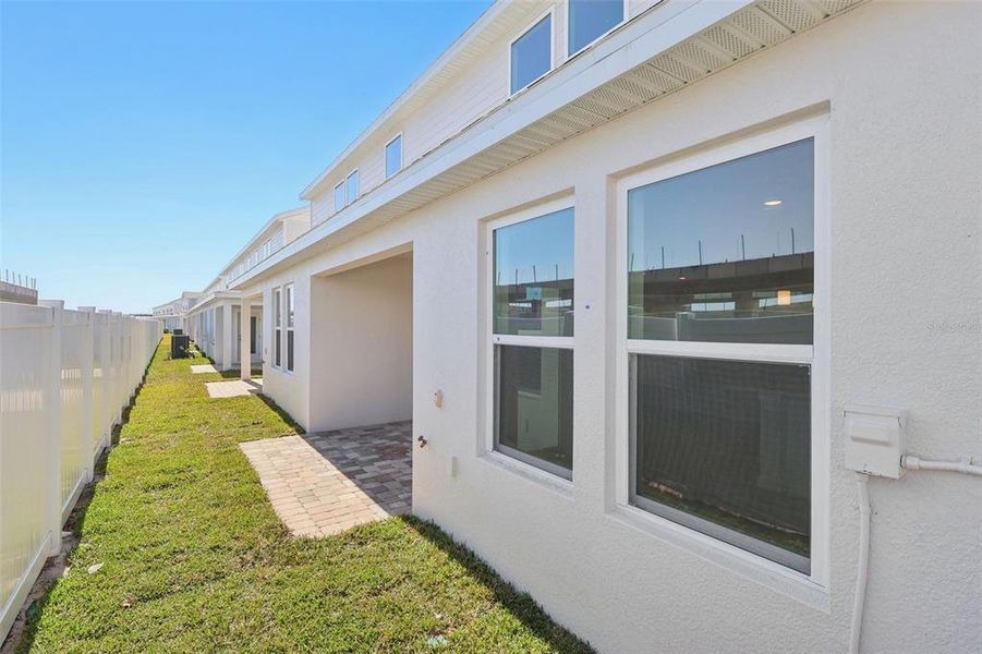 Exterior details and patio area of a home in Cyrene at Harmony, St. Cloud (Image 20).