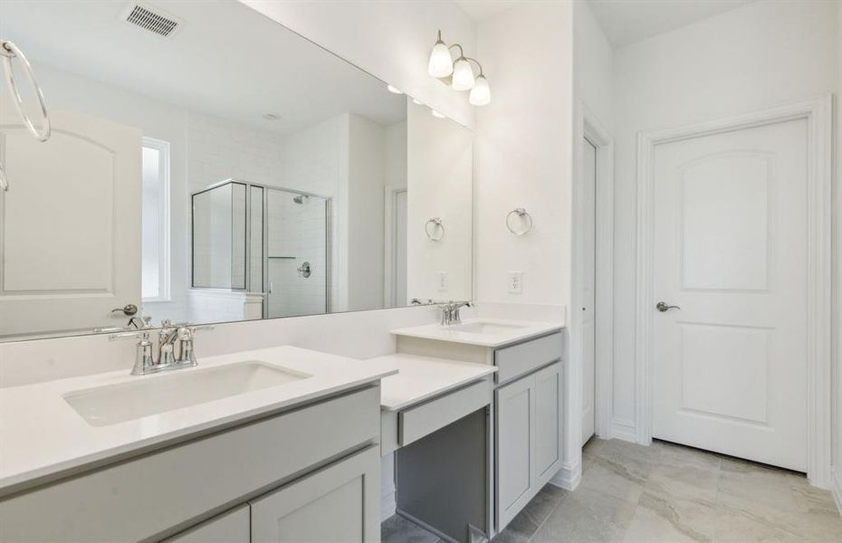 Owner's bathroom with dual vanity and oversized shower*real home pictured