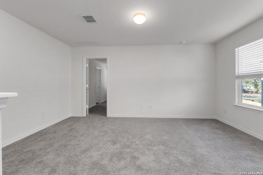 Spacious, unfurnished interior of a new home in Preserve at Culebra - Heritage Collection, San Antonio (Image 13).