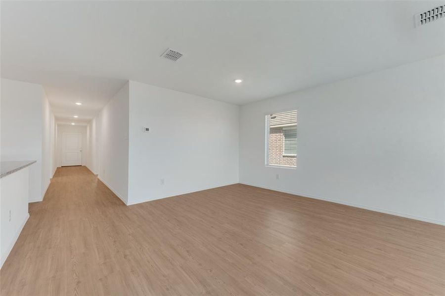 Spare room featuring light wood-type flooring