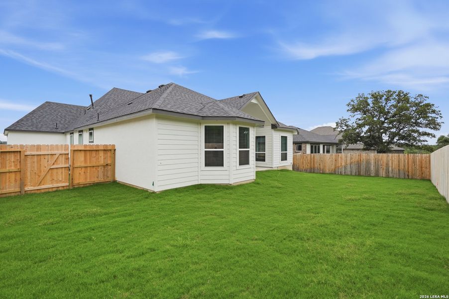 Exterior details and patio area of a home in The Reserve at Potranco Oaks, Castroville (Image 3).