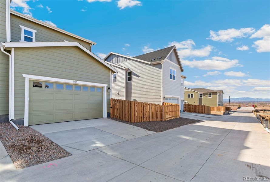 Exterior details and patio area of a home in Turnberry, Commerce City (Image 18).
