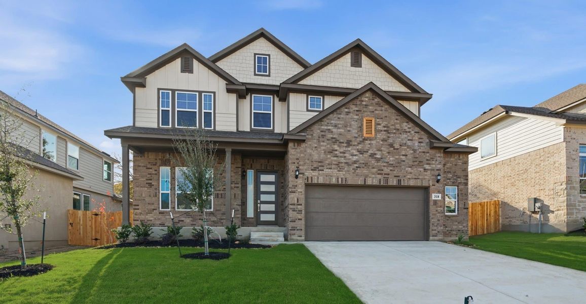 Front exterior of a new home in Buffalo Crossing, Cibolo, TX, highlighting curb appeal (Image 2). Front exterior of a new home in Buffalo Crossing, Cibolo, TX, highlighting curb appeal (Image 2).
