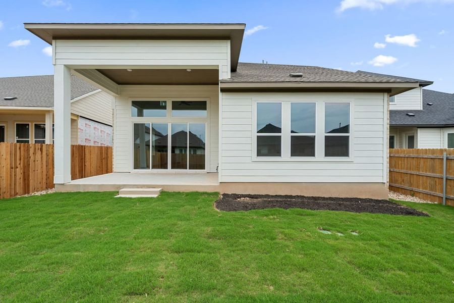 Exterior details and patio area of a home in Heritage, Dripping Springs (Image 28).