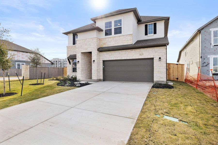 Front exterior of a new home in Park Central, Georgetown, TX, highlighting curb appeal (Image 2). Front exterior of a new home in Park Central, Georgetown, TX, highlighting curb appeal (Image 2).