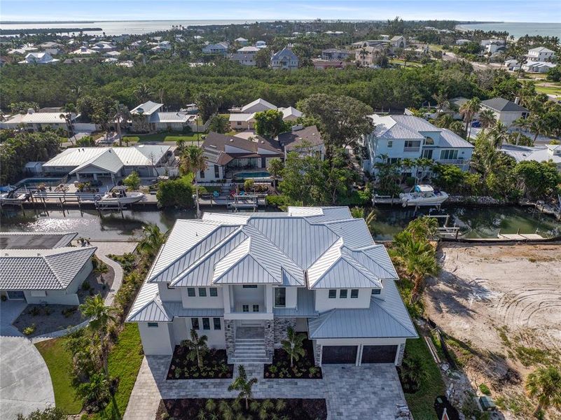 Front exterior of a new home in , Longboat Key, FL, highlighting curb appeal (Image 29). Front exterior of a new home in , Longboat Key, FL, highlighting curb appeal (Image 29).