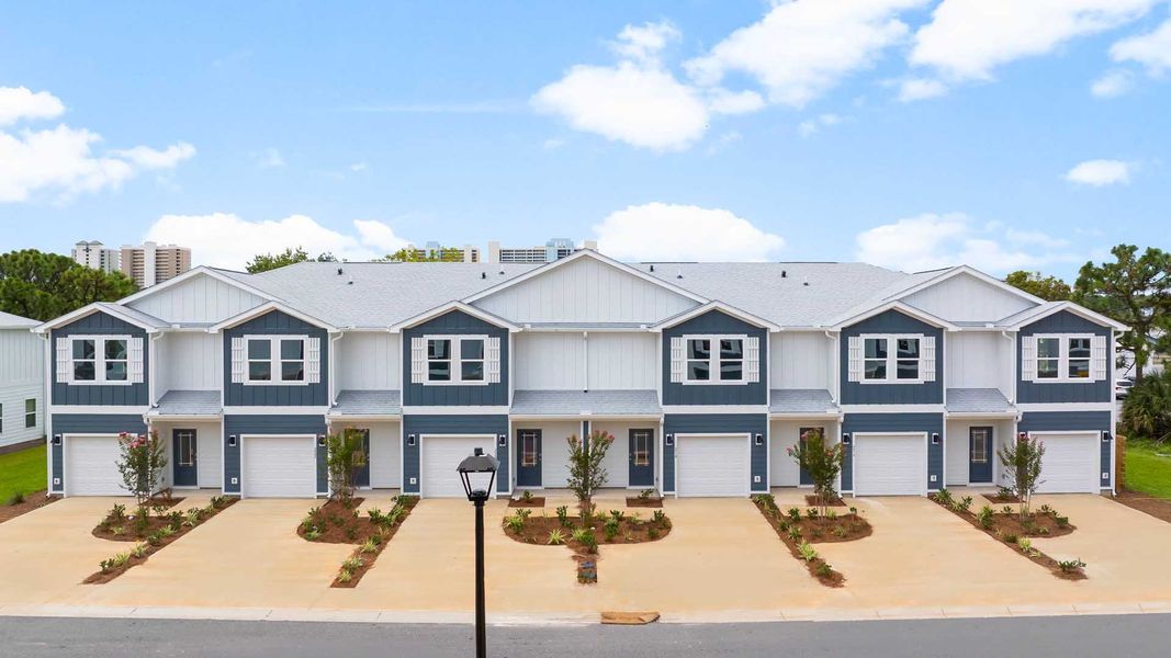 Representative exterior photo of a completed home built from the Palm Interior by D.R. Horton in Caballeros Estates Townhomes at Hombre, Panama City Beach, FL (Image 1). Representative exterior photo of a completed home built from the Palm Interior by D.R. Horton in Caballeros Estates Townhomes at Hombre, Panama City Beach, FL (Image 1).