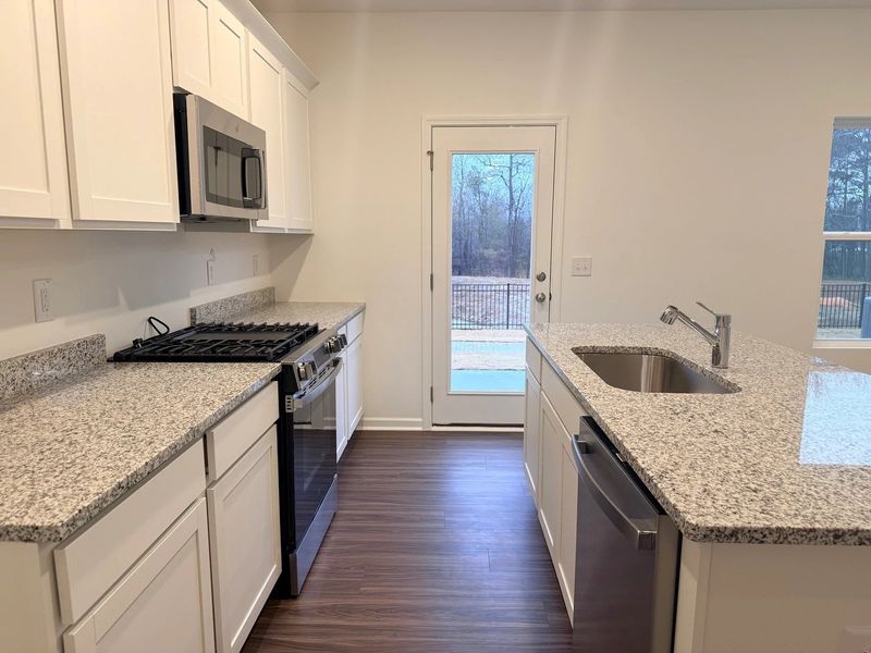 Kitchen - Chic white finishes and smooth surfaces shine. Kitchen - Chic white finishes and smooth surfaces shine.