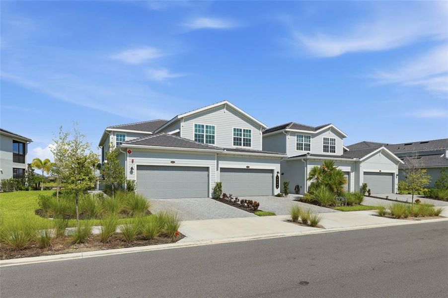 Front exterior of a new home in , Punta Gorda, FL, highlighting curb appeal (Image 28).