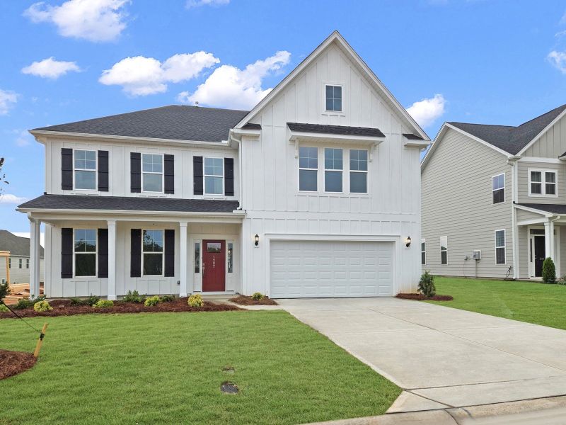 Front exterior of a new home in Cottages at Lake Emory, Inman, SC, highlighting curb appeal (Image 1). Front exterior of a new home in Cottages at Lake Emory, Inman, SC, highlighting curb appeal (Image 1).