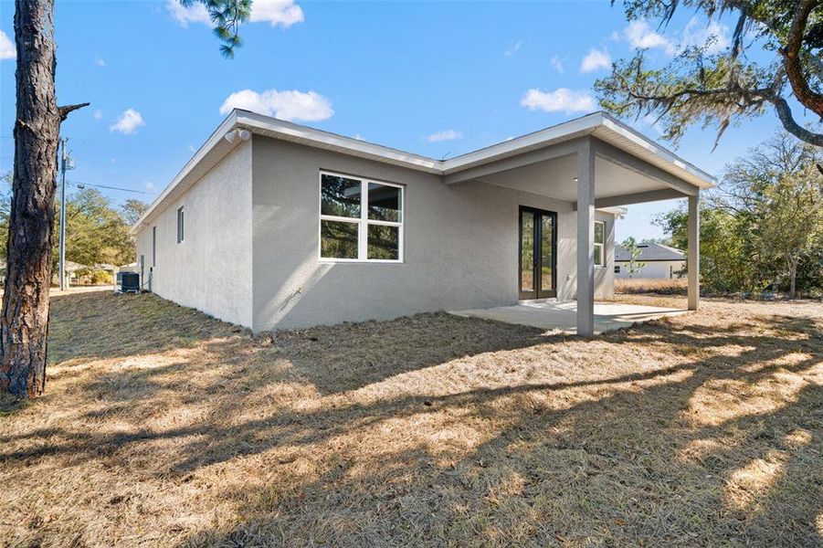 Exterior details and patio area of a home in , Citrus Springs (Image 39).