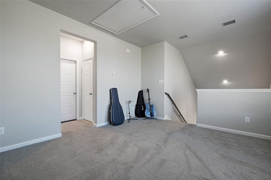 Carpeted game room upstairs