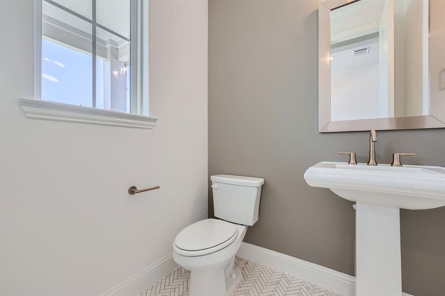 Bathroom with tile patterned flooring and toilet