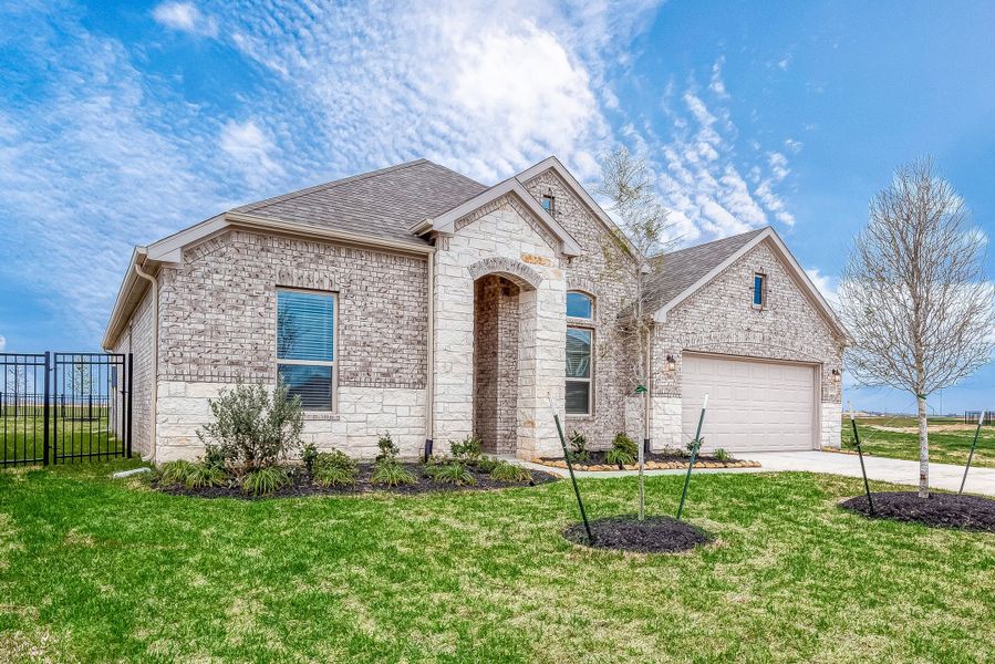 Representative exterior photo of a completed home built from the Floor Plan 2050 by Colina Homes in Grand Magnolia, Magnolia, TX (Image 26).