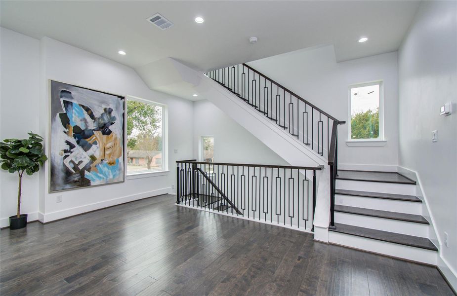 Beautiful railing that allows for light to flow and keep spaces open.