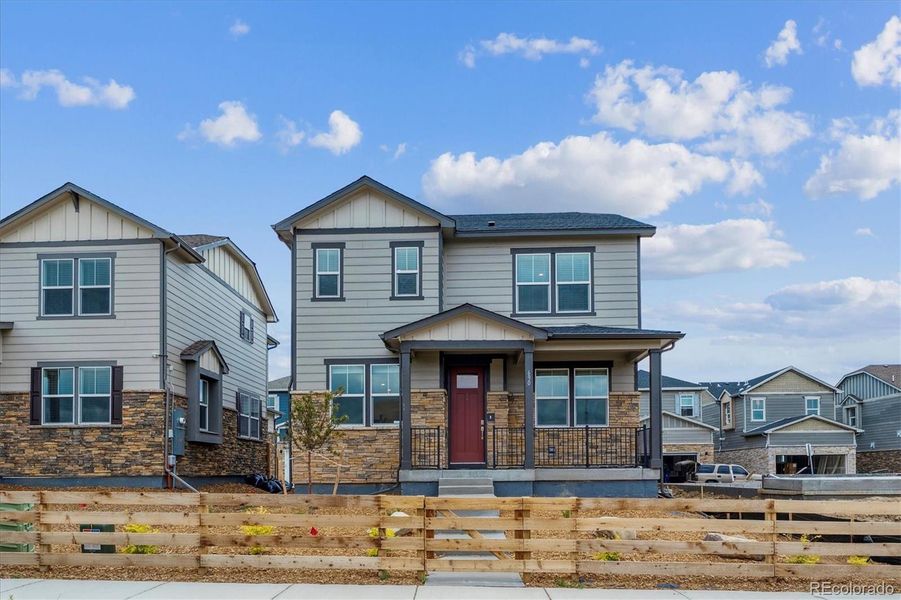 Front exterior of a new home in Horizon Uptown, Aurora, CO, highlighting curb appeal (Image 19).