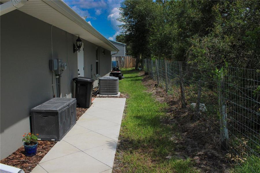 Exterior details and patio area of a home in , Summerfield (Image 28).